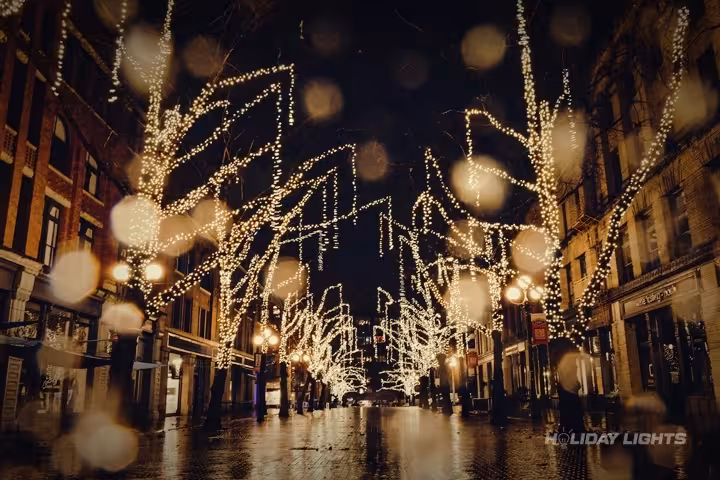 Professional cityscape Christmas lights decoration illuminating Boston skyline during holiday season