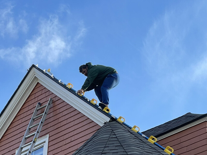Holiday Lights Decor crew installing Christmas lights